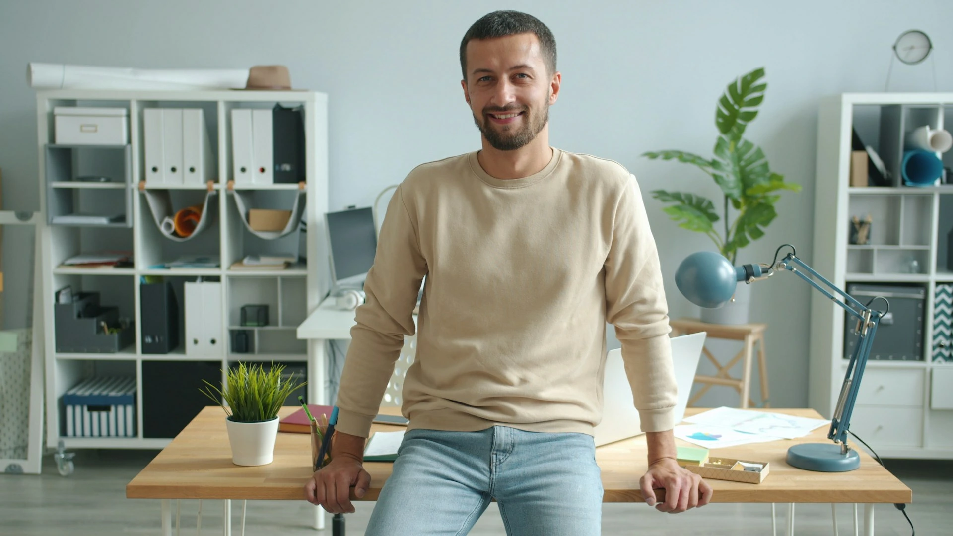 Man smiling in modern office setting